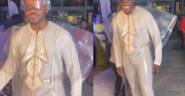 Actor Deyemi Okanlawon grabs attention as he makes an entrance at a movie premiere
